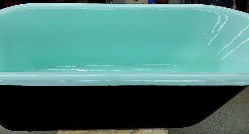 Mint green and glossy black clawfoot tub refinished by Blackstone Tub Refinishers Calgary