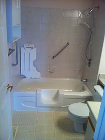 A custom walk-in-tub door insert with a fold down chair for those with disabilities in a bathroom.