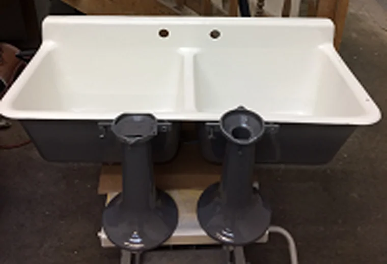 Image of a professionally refinished cast iron laundry sinks.